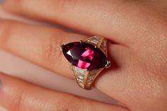 For Sale on 1stDibs - Make a statement with this one-of-a-kind ring, designed to stand out from the crowd. Its centre stone is a large ruby featured in an elegant marquise cut, Luxury Marquise Ruby Ring, Luxury Marquise Red Ruby Ring, Luxury Red Marquise Ruby Ring, Ruby Marquise Ring, Luxury Red Marquise Cut Ruby Ring, Luxury Marquise Cut Red Ruby Ring, Luxury Ruby Ring Marquise Cut For Formal Events, Luxury Ruby Marquise Cut Ring For Formal Occasions, Luxury Marquise Cut Ruby Ring For Formal Occasions