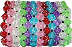 many different colored dices are stacked together