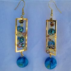 Artistic Ocean Style Artsy Blue Metal Jewelry, Artsy Blue Jewelry For Party, Artistic Blue Earrings With Ear Wire, Artistic Blue Party Earrings, Artistic Adjustable Yellow Earrings, Artsy Blue Dangle Earrings, Adjustable Artistic Yellow Earrings, Artsy Blue Earrings For Party, Yellow Dangle Earrings In Artsy Style