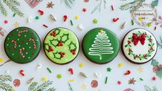 three decorated cookies sitting on top of a table