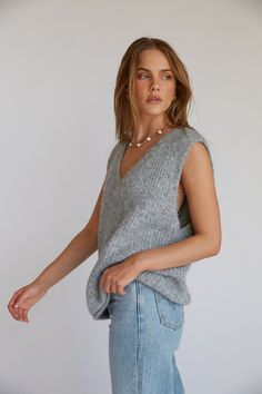 Channel your inner cool girl in the Spencer Wool Sweater Vest! This sleeveless vest features a high quality wool fabrication, baggy fit, and v neckline. Available in Grey; style with your go-to denim to complete the look!Details: 59% Recycled Polyester, 21% Nylon, 11% Polyester, 8% Wool, 1% Spandex Some Stretch Hand wash cold / Lay Flat to Dry Style A Corset, How To Style A Corset, Unique Tops, Red Floral Top, The Spencer, Tops Trendy, Grey Style, Sequin Sweater, Sweater Sale