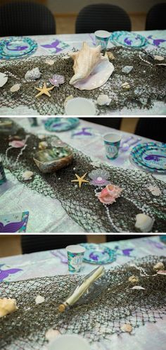 the table is covered with sea shells and other items