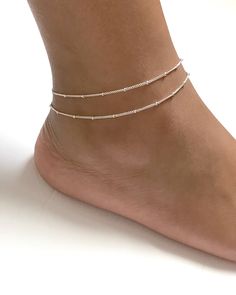 "Sterling Silver Adjustable Satellite Chain Anklet Double Layered Ankle Bracelet Minimalist and Dainty Ankle Bracelet Metal: All Components Are Made From Solid .925 Sterling Silver **Choose Size At Checkout** *Adjustable from 8\" to 9\" *Adjustable from 9\" to 10\" *Adjustable from 10\" to 11\" Please Read Store Policy Before Purchase You can find more anklets in my store here: https://www.etsy.com/shop/LinksAndStones?ref=simple-shop-header-name&listing_id=687470766&section_id=26197034 T Elegant Beaded Anklets With Ankle Strap, Elegant Summer Bracelets With Tiny Beads, Elegant Adjustable Anklet With Tiny Beads, Elegant Adjustable Anklets With Silver Beads, Adjustable Beaded Chain Anklet As Gift, Minimalist Anklets For Gift, Summer Gift Beaded Chain Anklets, Elegant Summer Anklets With Round Beads, Ankle Wrap Anklets With Tiny Beads For Gifts