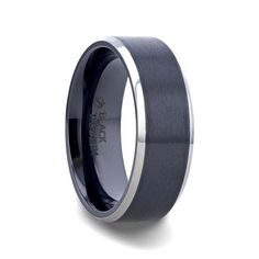 a black and silver wedding ring with an inlay