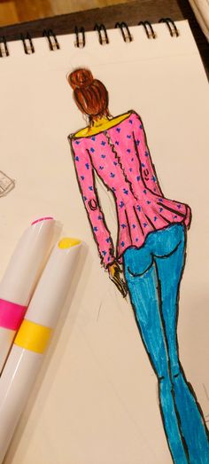 a drawing of a woman in pink shirt and blue jeans next to two markers on a sheet of paper