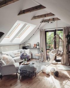 a living room filled with furniture and lots of windows