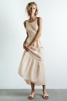 Indulge in a sunny escapade with the Alameda Tie-Back Maxi Dress! This airy day dress is crafted from a cozy cotton blend and features a scoop neckline held up by contrasting wide straps that are tied at the exposed back. A sleeveless smocked bodice sits atop a high waist and descends into a tiered maxi dress.
  Cotton Blend.
 Unlined.
 Runs true to size.
 Hand Wash Cold. Do Not Bleach. Line Dry. Iron Low Heat.
 Origin China.
     Size Chart (Unit cm)   Size Bust  Waist
   Hip
   Length
    XS 76-96 68-84 - 130   S 80-100 72-88 - 131   M 84-104 76-92 - 132   L 88-108 80-96 - 133   Error Margin: 1-3 cm    
** Color may vary due to lighting on images. The product images (without model) are closest to the true color, pattern and style of the product. Rustic Dresses, Mix & Match, Clothing Details, Round Neck Dresses, Loose Outfit, Tiered Maxi Dress, Crop Top Blouse, Urban Chic, Fashion Pattern