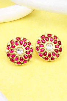 Gold plated round shaped stud earrings with ruby stones and kundan embellishments in floral pattern.
Type: Ruby and Kundan
Composition: Silver
Color: Gold
Other Details: 
Handcrafted
Length (in inches): 1
Weight (in gms): 26
Closure: Push back
Disclaimer: The jewellery is handcrafted therefore variations may occur
 - Aza Fashions Festive Bridal Earrings With Gemstones, Gemstone Round Earrings For Diwali, Round Gemstone Earrings For Diwali, Diwali Gemstone Round Earrings, Round Earrings With Stone Setting For Festivals, Round Stone-set Earrings For Festivals, Ruby Round Earrings For Festivals, Round Stone Setting Earrings For Festivals, Festive Round Earrings With Gota Work