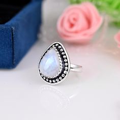 》D E T A I L S《 ✦Stone :- Moonstone ✦Stone Size:-12x15 MM  ✦Stone Shape:- Pear ✦Stone Type:- Natural ✦Metal:- Sterling Silver  ✦Weight:- 5 Gram (Approx) ✦Ring Size:- All Size Available 》C U S T O M I Z E O R D E R《 We accept custom and personalized order. It can be change in the gemstone, earring design and earring size. Please send us message if you are interested in a custom creation. 》 P A C K A G I N G 《 Your jewelry will be nicely packaged. If one or more items are gifts, please leave us a White Crystal Birthstone Ring As Gift, White Crystal Birthstone Ring For Gift, White Crystal Birthstone Ring With Round Stone, White Gemstone Teardrop Ring, White Moonstone Open Ring For Anniversary, White Teardrop Gemstone Ring, White Open Moonstone Ring For Anniversary, White Teardrop Sterling Silver Rings, Adjustable White Rings With Stones