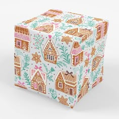 a present box with gingerbread houses on it