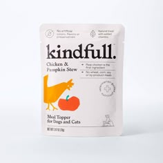 a packet of kindful chicken and pumpkin stew on a white background with an orange bird