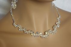 Beautiful Swatement Necklac perfect for special occasion - as a compliment to bride or bridesmaid dress. This necklace will definatelly add this special something to your special day!! Necklace details: * necklace is made with 4,5 and 6 mm  Crystal AB Bicone Crystals and white Pearls  * necklace is adjustable, please choose necklace length from drop down menu at the bottom. There's an 1.5 inch (4cm) extender chain added to each necklace length so for example if you choose 18 inches long necklace, extender length will be added to it.  * all of the findings are solid sterling silver or stainless steel, please choose finish from drop down menu at the bottom. Model wears 18 inches long necklace. (46cm). This Necklace will come in a pretty gift box. No extra charge for it. Please note this item Sparkling White Necklace For Wedding, Sparkling White Wedding Necklace, White Sparkling Bridal Necklace For Wedding, Sparkling White Bridal Necklace For Wedding, Pearl White Crystal Bridal Necklace For Wedding, Sparkling White Bridal Necklace As Gift, Beaded Crystal Bridal Necklace For Anniversary, Sparkling Crystal Necklaces For Wedding, Crystal Beaded Bridal Necklace For Anniversary