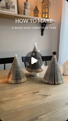 three christmas trees made out of book pages sitting on top of a wooden table with text overlay how to make a book page christmas tree