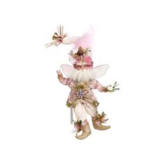 a fairy figurine is dressed in pink and white with gold trimmings