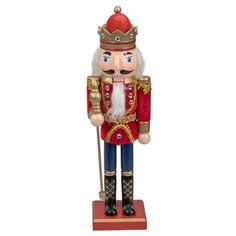 a wooden nutcracker with a crown on it's head and holding a cane