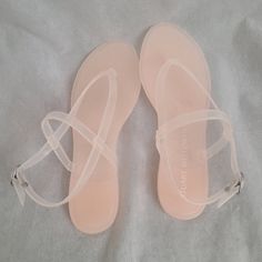 A Classic Wardrobe Staple, The Stuart Weitzman Summer Jelly Sandal. Rubber Upper, Lining, And Insole. Lightweight And Water-Resistant. Round Toe With Post. Adjustable Ankle Strap With Flat Block Heels. Rubber Outsole. Imported. Measurements: Heel Height: 12 In Weight: 9 Oz Heel Height: 12 In Blush Round Toe Sandals For Summer, Blush Round Toe Summer Sandals, Blush Synthetic Sandals With Round Toe, Blush Round Toe Synthetic Sandals, Spring Pink Sandals With Translucent Outsole, Pink Open Toe Sandals With Translucent Outsole, Gladiator High Heels, Stuart Weitzman Sandals, White Studs