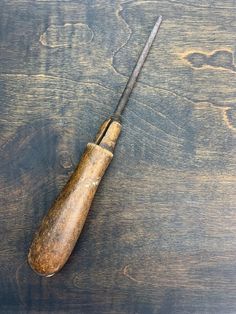 an old wooden baseball bat laying on top of a table