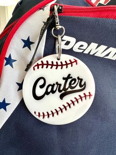 a baseball shaped keychain with the word'center'on it