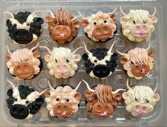 twelve cupcakes in the shape of farm animals