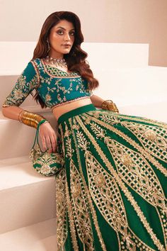 Pakistani Wedding Dress with Green Lehenga Choli and Blue Contrast is Richly embroidered and sequinned emerald green lehnga with teal blue rawsilk choli. Wedding Dress With Green, Walima Dresses Pakistani, Pakistani Mehndi Dress, Green Lehenga Choli, Pakistani Lehenga, Walima Dress, Green Wedding Dresses, Indian Bridal Sarees, Indian Bridal Lehenga