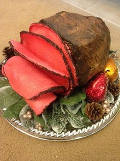 a platter filled with fruit and vegetables on top of a table