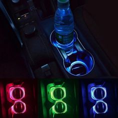 the interior of a car is lit up with colorful lights and an illuminated bottle holder