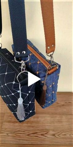 two purses hanging from the side of each other