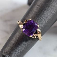 A Womens Vintage Estate 10k Yellow Gold Amethyst Colored Stone Ring. The Ring Weighs 1.9g, And Is A Size 4.75. The Length Of The Ring Is 5/16". Ring Is Marked On The Inside Of The Band. Any Questions, Please Don't Hesitate To Ask. This Would Make A Lovely Gift. Be Sure To Check Out Some Of My Other Great Items Up For Sale. Thank You. 14k Gold Purple Emerald Cut Rings, Purple 14k Gold Rings With Emerald Cut, Purple 14k Gold Ring With Emerald Cut, Purple Amethyst Ring With Prong Setting In 14k Gold, 14k Gold Purple Amethyst Ring, 14k Gold Amethyst Ring With Purple Gemstone, Purple Amethyst Ring In 14k Gold, Classic 14k Gold Purple Amethyst Ring, Classic Purple Gemstone Birthstone Ring