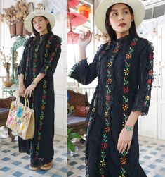 "Vintage Mexican hand embroidered dress in shade of black with colourful floral hand embroidered. Tailored with half puff sleeves and lace trim. Cotton material. Dress zips up the back. Measurements (Inch) size estimate: M *Measurements are taken in inches with the garment laying flat. BUST: 38 \" WAIST: 34 \" HIPS: 40 \" FULL LENGTH: 56 \" SLEEVES LENGTH : 18 \" Condition: In very good vintage condition. *If you are not sure about size please feel free to contact me I would be happy to help all Black Dresses With Intricate Embroidery For Festivals, Traditional Black Dress With Intricate Embroidery, Traditional Black Spring Dresses, Traditional Embroidered Short Sleeve Ao Dai, Traditional Black Dress With Resham Embroidery, Traditional Black Embroidered Dress, Traditional Black Dress With Embroidered Hem, Black Folk Style Dress For Festivals, Folk Style Black Dress For Festivals