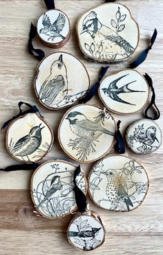 six handmade wood slices with birds on them