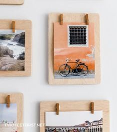 four wooden frames with pictures hanging on the wall next to each other and one has a bike