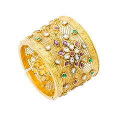 Blend art and luxury with this confection of Kundan designs and radiant gold with this 22K yellow antique gold bangle cuff from Virani Jewelers!! Features: • Antique-finished 22K yellow gold • Brilliant Kundan • Heavy detailed bangle cuff Virani Jewelers has set the bar on luxury jewelry and fine 22K gold pieces. This exquisite 22K yellow antique gold bangle cuff is beautifully embellished in an artistic display of Kundan. The embellishments are seamlessly placed atop a heavily detailed wide ban Traditional Yellow Gold Bangle With Intricate Design, Ceremonial Festive Bangle With 17 Jewels, Traditional 22k Yellow Gold Cuff Bracelet, Gold Hand Set Cuff Bracelet For Festivals, Festive Gold Cuff Bracelet With Intricate Design, Traditional Yellow Gold Cuff Bracelet For Festivals, 22k Gold Bracelets With Intricate Design For Festive Season, Traditional 22k Gold Bracelet With Intricate Design, Festive Yellow Gold Bangle With 17 Jewels