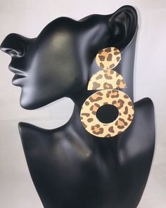 Add a little spice to your Fall wardrobe with these leopard print statement earrings. They're so light you won't even feel like your wearing earrings. Stand out at your next party, date night, girls night or grocery store run. They are perfect for EVERY OCCASION.  Glam (Brown/Tan Animal Print) Genuine Leather Earrings Lightweight Handmade  3.5 Inches long, 2 Inches Wide  Ships is 1-2 business days Free shipping on U.S orders over $35 Returns are Welcomed  Follow me on instagram @thesparklegirl001  Check out my Etsy store: SparkleGirlEarrings Leopard Print Drop Earrings Gift, Leopard Print Earrings For Gift, Leopard Print Earrings For Pierced Ears As Gift, Trendy Leopard Print Dangle Earrings, Trendy Leopard Print Dangle Jewelry, Handmade Leopard Print Earrings, Trendy Leopard Print Earrings As Gift, Leopard Earrings, Earrings Stand