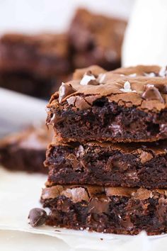 chocolate brownies stacked on top of each other