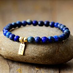 The Handmade Natural Lapis Lazuli Beaded Bracelet with a Gold Plated Tag looks great. It will make the perfect gift 🎁 for someone special, or treat yourself as you deserve it 💖 🥰 These Bracelets have been made using high quality Natural Lapis Lazuli and have a Gold Plated Tag with MC for MantraChakra. They are available as 4mm, 6mm and 8mm. Lapis Lazuli brings out your inner priestess, heightens inner-vison and deepens wisdom. It benefits the Throat Chakra with communication and expression of Adjustable Polished Beads Charm Bracelet Gift, Polished Beads Charm Bracelet As Gift, Gift Lapis Lazuli Beaded Bracelets With Polished Beads, Minimalist Polished Beads Bracelets As Gift, Minimalist Polished Bead Bracelets As Gift, Lapis Lazuli Beaded Bracelet Gift, Minimalist Polished Beads Bracelet As Gift, Lapis Lazuli Gemstone Beads Bracelet For Gift, Lapis Lazuli Gemstone Beaded Bracelet For Gifts