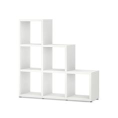 a white bookcase with four shelves on each side