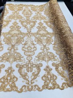 gold and white lace on a table