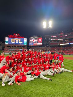 the baseball team is posing for a photo on the field