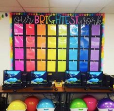 brightly colored balls are lined up in front of a wall with the words our bright stuff on it