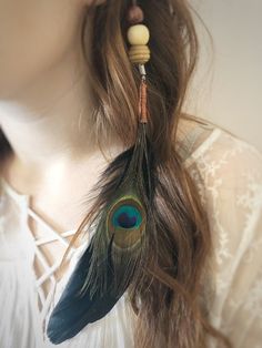 These feather hair pieces are a perfect accent for costumes or just everyday use! The feathers are fastened to a leather string which connects to a barrette for easy attachment. These are each hand made with a goose and peacock feather. If the white or gray goose feathers interest you, there is a separate listing for those that you can find on our store page! GET 15% OFF Don't forget to sign up for our Wicked Earth Community mailing list for 15% off! Go to our official web page WWW.OurWickedEarth.Com and scroll to the bottom of our home page to sign up. The coupon will work on both Etsy and our website! SHIPPING & HANDLING We calculate all shipping costs based on items weight and size once packaged. The only other cost is a small shipping & handling fee of $1.99 that just helps us cover pa Feather Hair Pieces, Beaded Hair Extensions, Feather Extensions, Bead Hair Accessories, Beaded Hair, Feather Hair Clips, Goose Feather, Feather Hair, Bohemian Hairstyles