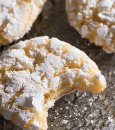 powdered sugar covered cookies sitting on top of a table