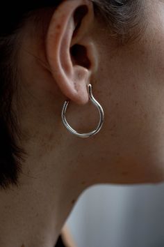 Modern pair of sterling silver minimalist stud hoop earrings with organic shape. You can find these open hoop earrings also in gold plated brass or solid gold. These delicate clean lines hoop earrings are exactly the modern and edgy hoops you need to have.It's raw texture highlights the craftsmanship that was used to make the earrings, and makes it more unique then the generic hoop earrings. ✔ Nickel Free✔ Packed in a labeled gift box✔ Hand made with love in Tel Aviv✔ 14 days return policy, star Minimalist Everyday Hammered Huggie Earrings, Everyday Minimalist Hammered Huggie Earrings, Minimalist Sterling Silver Pierced Hoop Earrings, Everyday Silver Wrap Earrings, Modern Twist Silver Earrings For Everyday, Minimalist Sterling Silver Single Hoop Earring, Everyday Silver Earrings With A Modern Twist, Modern Small Hoop Jewelry With Simple Design, Minimalist Sterling Silver Hoop Earrings For Pierced Ears