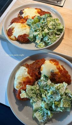 two white plates topped with different types of food