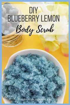 blueberry lemon body scrub in a white bowl on a yellow table with flowers and mason jars