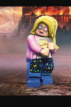 there is a lego girl holding a book in front of a burning castle and fire