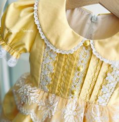 Elegant Doll Collar Dress For Dress-up, Fitted Princess Dress With Ruffles And Short Sleeves, Sweet Princess Dress For Baptism, Yellow Princess Dress For Dress-up, Cute Fitted Princess Dress With Ruffles, Elegant Cotton Dress For Dress-up, Elegant Yellow Princess Dress For Dress-up, Elegant Cotton Dress For Dress-up Occasions, Elegant Cotton Dress For Formal Occasions