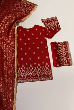 Maroon pure raw silk 58 gms embellished with zari and clusters of sequins on a short length kameez with hand/Ada buttons on neckline, styled with flappers and pure banarsi chiffon dupatta. The length of the Kameez is 36 inches. ( Shade number 4343 ) Order Duration: 4 to 6 weeks Red Dola Silk Kurta With Sheer Dupatta, Festive Raw Silk Salwar Kameez For Eid, Red Churidar With Sheer Dupatta In Chinon, Festive Raw Silk Churidar With Mirror Work, Festive Jamawar Kurta With Mirror Work, Traditional Lawn Suit With Sheer Dupatta For Festive Occasions, Festive Traditional Lawn Suit With Sheer Dupatta, Unstitched Straight Kurta Suit With Sheer Dupatta In Chinon, Straight Kurta Churidar With Mirror Work In Jamawar