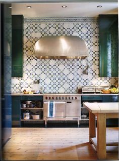 a kitchen with an oven, stove and counter top in it's center island