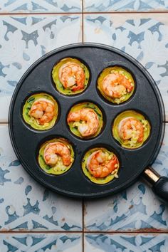 an overhead view of some food in a muffin tin