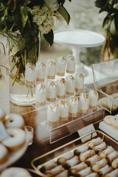 desserts and pastries are on display at a wedding reception or bridal party